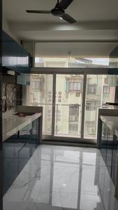 Kitchen Image of 1100 Sq.ft 3 BHK Apartment / Flat for rent in Swapnpoorti, Nerul Navi Mumbai for Rs. 85000