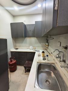 Kitchen Image of 815 Sq.ft 3 BHK Builder Floor for rent in Sector 4 Rohini New Delhi for Rs. 30000