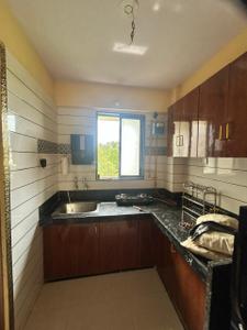 Kitchen Image of 850 Sq.ft 1 BHK Apartment / Flat for rent in Chala Vapi for Rs. 12500