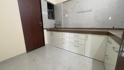 Kitchen Image of 900 Sq.ft 2.5 BHK Apartment / Flat for rent in Ten United Athashri, Lohegaon Pune for Rs. 25000
