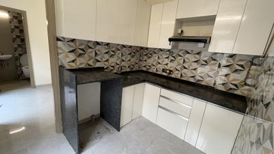 Kitchen Image of 750 Sq.ft 2 BHK Apartment / Flat for sale in Ajmera Bhakti Park, Wadala East Mumbai for Rs. 19000000
