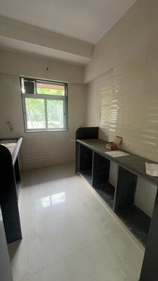Kitchen Image of 800 Sq.ft 2 BHK Apartment / Flat for sale in Glasswood Om Sarjan CHSL, Borivali West Mumbai for Rs. 19500000