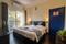 Bedroom Image of HelloWorld Riverbankinn in Morjim, Goa