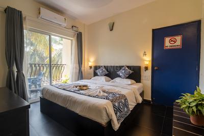 Bedroom Image of HelloWorld Riverbankinn in Morjim, Goa