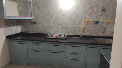 Kitchen Image of 1150 Sq.ft 2 BHK Apartment / Flat for rent in Swagat Queens Land, Sargasan Gandhinagar for Rs. 30000