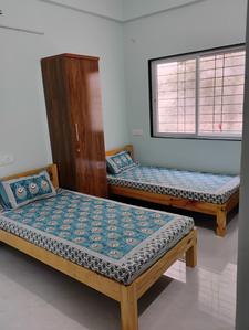 Bedroom Image of Vrinda Girls PG in Rahatani, Pune