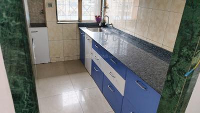 Kitchen Image of 660 Sq.ft 2 BHK Apartment / Flat for rent in Kashish Park, Dharamveer Nagar Thane for Rs. 35000