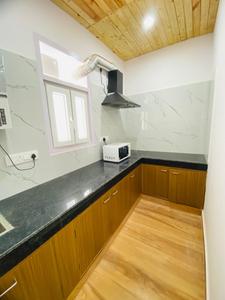 Kitchen Image of Urbanroomz Coliving PG in Sector 30, Gurgaon