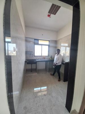 Kitchen Image of 710 Sq.ft 1 BHK Apartment / Flat for sale in Ulhasnagar Thane for Rs. 4800000