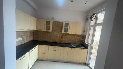 Kitchen Image of 935 Sq.ft 2 BHK Apartment / Flat for sale in Mahagun Mywoods Phase 3, Noida Extension Greater Noida for Rs. 7600000