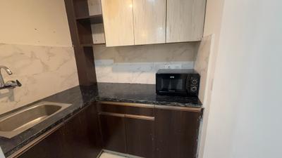 Kitchen Image of 550 Sq.ft 1 BHK Builder Floor for rent in Sector 57 Gurgaon for Rs. 37500