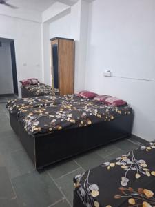 Bedroom Image of Jai Ambe Boys PG in Chanakyapuri, Ahmedabad