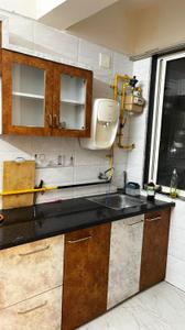 Kitchen Image of 850 Sq.ft 1 BHK Apartment / Flat for rent in Applewoods Satyesh Residency, Shela Ahmedabad for Rs. 21500