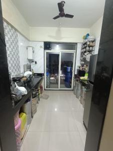Kitchen Image of 950 Sq.ft 2 BHK Apartment / Flat for sale in Gajra Bhoomi Lawns, Shilphata Thane for Rs. 6100000
