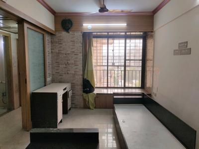Living Room Image of 600 Sq.ft 1 BHK Apartment / Flat for sale in Suyash Tower, Kopar Khairane Navi Mumbai for Rs. 9800000