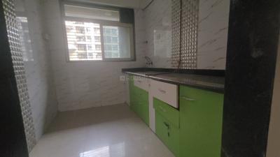 Kitchen Image of 960 Sq.ft 2 BHK Apartment / Flat for rent in Mohan Willows I, Badlapur East Badlapur for Rs. 13000
