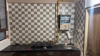 Kitchen Image of 900 Sq.ft 2 BHK Apartment / Flat for rent in Armaan Nandanvan, Narolgam Ahmedabad for Rs. 17000