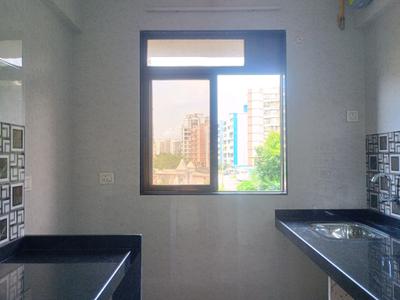 Kitchen Image of 730 Sq.ft 1 BHK Apartment / Flat for sale in Mohan Precious Greens Phase I, Ambernath East Ambernath for Rs. 3300000