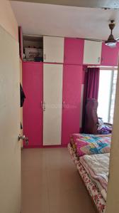 Bedroom Image of 614 Sq.ft 1 BHK Apartment / Flat for sale in Sarthak Beaulieu, Pisoli Pune for Rs. 3300000