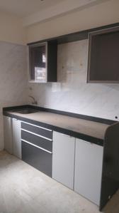 Kitchen Image of 1050 Sq.ft 2 BHK Apartment / Flat for sale in Vishesh Balaji Symphony, Shilottar Raichur Navi Mumbai for Rs. 7800000