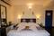 Bedroom Image of HelloWorld Riverbankinn in Morjim, Goa