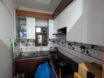 Kitchen Image of 600 Sq.ft 2 BHK Builder Floor for rent in Guru Ji Builders And Developers 1, Dwarka Mor New Delhi for Rs. 19500