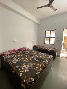 Bedroom Image of Jai Ambe Boys PG in Chanakyapuri, Ahmedabad