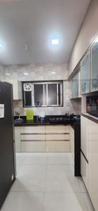 Kitchen Image of 850 Sq.ft 2 BHK Apartment / Flat for sale in Axis Whistling Meadows, Bhugaon Pune for Rs. 10500000