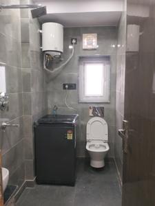Common Bathroom Image of 370 Sq.ft 1 RK Apartment / Flat for rent in DLF Capital Greens, Karampura New Delhi for Rs. 26000