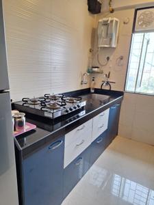 Kitchen Image of 930 Sq.ft 2 BHK Apartment / Flat for rent in Cosmos Classique, Thane West Thane for Rs. 40000