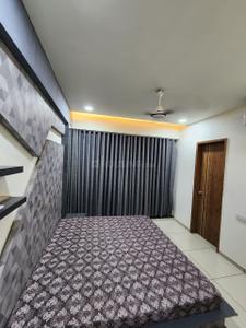 Bedroom Image of 1100 Sq.ft 3 BHK Apartment / Flat for rent in Shambhu Savan Signet, Radhika Park Rajkot for Rs. 34000