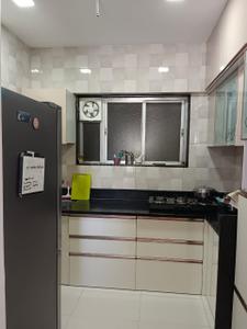 Kitchen Image of 850 Sq.ft 2 BHK Apartment / Flat for sale in Axis Whistling Meadows, Bhugaon Pune for Rs. 10500000