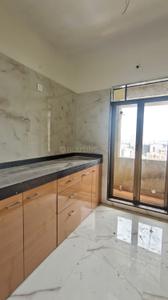 Kitchen Image of 1050 Sq.ft 2 BHK Apartment / Flat for rent in Puraniks Home Town, Kasarvadavali Thane for Rs. 29000