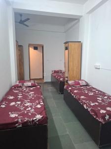 Bedroom Image of Jai Ambe Boys PG in Chanakyapuri, Ahmedabad
