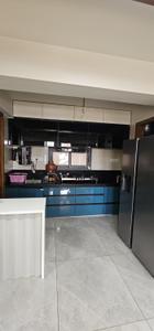 Kitchen Image of 900 Sq.ft 3 BHK Apartment / Flat for sale in Atishay Shivalay III, Sargasan Gandhinagar for Rs. 11000000
