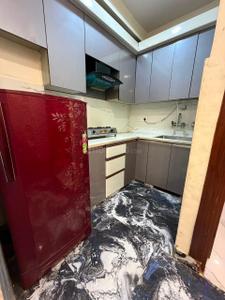 Kitchen Image of 412 Sq.ft 1 BHK Builder Floor for rent in Dwarka Mor New Delhi for Rs. 16500