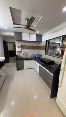 Kitchen Image of 1350 Sq.ft 3 BHK Apartment / Flat for sale in Raghuvir Sentosa Heights, Bhimrad Surat for Rs. 8000000