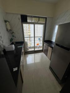 Kitchen Image of 600 Sq.ft 1 BHK Apartment / Flat for rent in Bhoomi Lawns Phase II, Shilgaon Thane for Rs. 18000