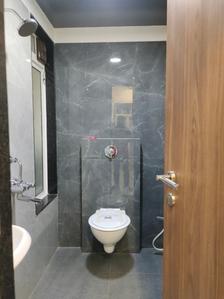 Common Bathroom Image of 650 Sq.ft 2 BHK Apartment / Flat for sale in Asmi Legend, Goregaon West Mumbai for Rs. 13800000