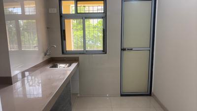 Kitchen Image of 721 Sq.ft 1 BHK Apartment / Flat for rent in Cosmos Meluha, Khidkali Thane for Rs. 12500