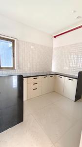 Kitchen Image of 900 Sq.ft 2 BHK Apartment / Flat for sale in Paranjape Blue Ridge, Hinjawadi Pune for Rs. 10300000
