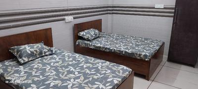 Bedroom Image of Sharma PG in Shahdara, New Delhi