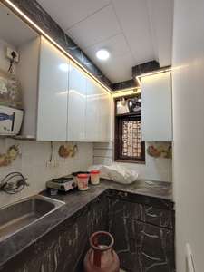 Kitchen Image of 450 Sq.ft 1 BHK Builder Floor for rent in Dwarka Mor New Delhi for Rs. 13000