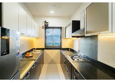 Kitchen Image of 950 Sq.ft 2 BHK Apartment / Flat for sale in UK lona, Andheri East Mumbai for Rs. 13400000