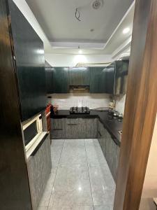 Kitchen Image of 972 Sq.ft 2 BHK Apartment / Flat for rent in Charms Castle, Raj Nagar Extension Ghaziabad for Rs. 17000
