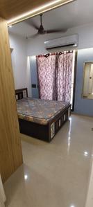 Bedroom Image of 780 Sq.ft 1 BHK Apartment / Flat for rent in Applewoods Satyesh Residency, Shela Ahmedabad for Rs. 18000