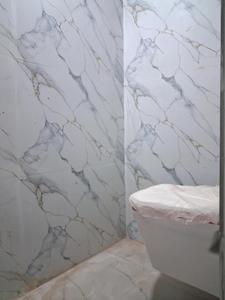 Common Bathroom Image of 1650 Sq.ft 3 BHK Apartment / Flat for sale in Sector 104 Noida for Rs. 6800000