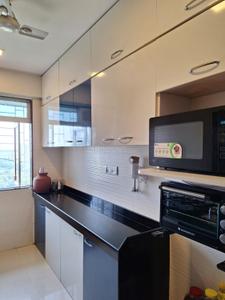Kitchen Image of 930 Sq.ft 2 BHK Apartment / Flat for rent in Cosmos Classique, Thane West Thane for Rs. 40000