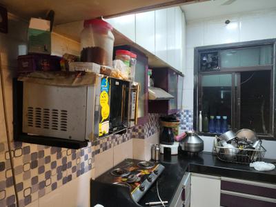 Kitchen Image of 700 Sq.ft 1 BHK Apartment / Flat for rent in Paradigm Pushpanjali Residency Phase III, Kasarvadavali Thane for Rs. 16548