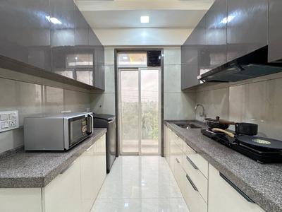 Kitchen Image of 1000 Sq.ft 2 BHK Apartment / Flat for sale in Mangeshi Dhara, Thakurli Thane for Rs. 7900000